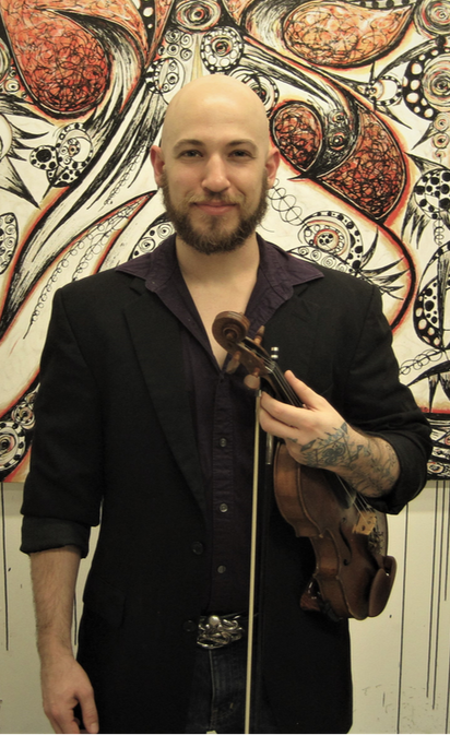 Photo of Julian Lambertson, owner of Green String Music Lessons, holding the fiddle he uses to teach fiddle lessons and violin lessons